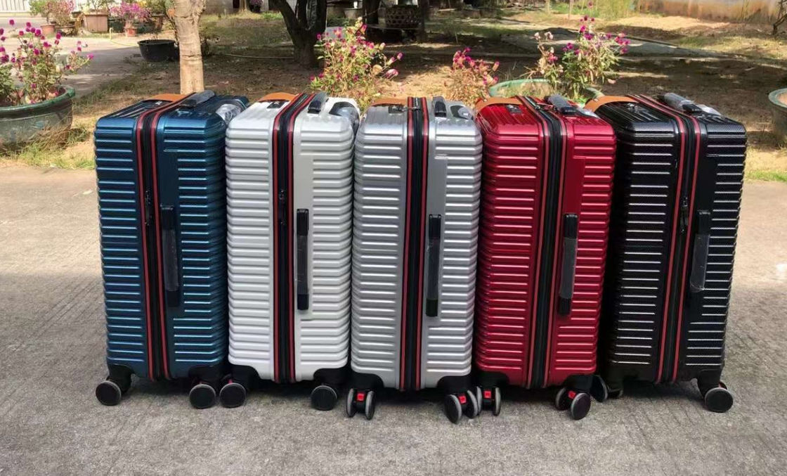 Αλουμινένιο πλαίσιο σκληρή πλευρά κυλιόμενο φερμουάρ αεροπορική θήκη OEM ODM Custom Label Αντι-γδαρισμός ταξιδιωτική βαλίτσα βαλίτσα με 4 Whee